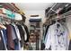 Walk-in closet with shelving and hanging space perfect for organizing clothes and personal belongings at 4647 Gazebo Ct, New Port Richey, FL 34655