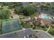 Aerial view featuring the community's amenities, including tennis courts, a pool, and recreational facilities at 4647 Gazebo Ct, New Port Richey, FL 34655