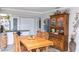Inviting dining room with wood floors and a classic china cabinet with glass doors for displaying collectibles at 4647 Gazebo Ct, New Port Richey, FL 34655