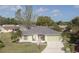 Inviting single-story home with a well-kept lawn, mature landscaping, and a welcoming front entrance at 4647 Gazebo Ct, New Port Richey, FL 34655