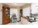Cozy kitchen boasts bright light, practical countertops and a display cabinet at 4647 Gazebo Ct, New Port Richey, FL 34655