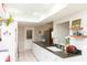 Bright kitchen featuring white cabinets, stainless steel appliances, and a decorative backsplash at 4647 Gazebo Ct, New Port Richey, FL 34655