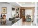Spacious kitchen features modern appliances, elegant backsplash, and granite countertops at 4647 Gazebo Ct, New Port Richey, FL 34655
