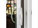 Close-up of sliding glass door handle at 4647 Gazebo Ct, New Port Richey, FL 34655
