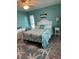 Comfortable bedroom featuring queen bed, dresser, and light wood flooring at 4678 Marine Pkwy # 305, New Port Richey, FL 34652