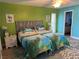 Bright bedroom features two twin beds with colorful bedding and a beach-themed aesthetic, plus ensuite bath at 4678 Marine Pkwy # 305, New Port Richey, FL 34652