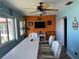 Bright bonus room with a modern ceiling fan and beach-themed wall decor at 4678 Marine Pkwy # 305, New Port Richey, FL 34652