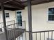 Condominium exterior featuring access to unit 305 from an exterior stairway and walkway at 4678 Marine Pkwy # 305, New Port Richey, FL 34652