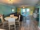 Open-concept living and dining area with hardwood floors and stylish decor at 4678 Marine Pkwy # 305, New Port Richey, FL 34652