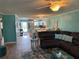 Cozy living room with an open floor plan connecting to the modern kitchen at 4678 Marine Pkwy # 305, New Port Richey, FL 34652