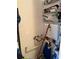 Small utility closet holds water heater and plumbing; closet used for storage of cleaning supplies at 4678 Marine Pkwy # 305, New Port Richey, FL 34652