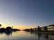 Scenic water view with boats docked along the canal in a well-maintained waterfront community at 4678 Marine Pkwy # 305, New Port Richey, FL 34652