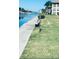 Peaceful waterfront view with lush greenery and a walking heron at 4678 Marine Pkwy # 305, New Port Richey, FL 34652