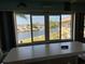 Waterfront view from the enclosed bonus room at 4678 Marine Pkwy # 305, New Port Richey, FL 34652