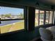 Waterfront view of the canal from an enclosed bonus room at 4678 Marine Pkwy # 305, New Port Richey, FL 34652