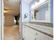 Bathroom vanity in a bedroom with an adjoining bathroom at 4836 Alamo Ct, New Port Richey, FL 34655