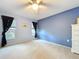 Bedroom features a ceiling fan, carpet, and black-out curtains at 4836 Alamo Ct, New Port Richey, FL 34655