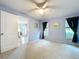 View of bedroom with open door at 4836 Alamo Ct, New Port Richey, FL 34655