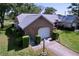 Charming single-story home featuring a well-maintained lawn, trimmed hedges, and attached one car garage at 4836 Alamo Ct, New Port Richey, FL 34655