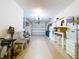 Spacious garage with overhead door and ample storage and seating areas at 4836 Alamo Ct, New Port Richey, FL 34655