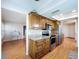 Spacious kitchen with granite counters, stainless steel appliances, and wood cabinets at 4836 Alamo Ct, New Port Richey, FL 34655