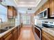 Well-appointed kitchen with granite countertops, modern appliances, and plenty of cabinet space at 4836 Alamo Ct, New Port Richey, FL 34655