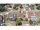 Aerial view of home with a fenced yard, shed, and well-maintained surroundings at 5092 Roble Ave, Spring Hill, FL 34608