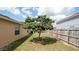 A shaded tree offers a calm vibe to the backyard space at 5092 Roble Ave, Spring Hill, FL 34608