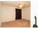 This bedroom features neutral carpet, a lighted ceiling fan, and warm brown curtains at 5092 Roble Ave, Spring Hill, FL 34608