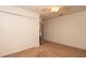 This bedroom features carpet, a ceiling fan, a closet, and neutral paint at 5092 Roble Ave, Spring Hill, FL 34608