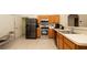 Modern kitchen with stainless steel appliances, oak cabinets, and ample counter space at 5092 Roble Ave, Spring Hill, FL 34608