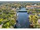 An aerial view of a waterway, bridge and lush greenery under a clear blue sky at 6329 Alaska Ave, New Port Richey, FL 34653