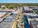 Aerial view of a downtown street with palm trees and buildings under a clear blue sky at 6329 Alaska Ave, New Port Richey, FL 34653