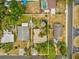 An aerial view showing the home and surrounding landscaped property and neighboring homes at 6329 Alaska Ave, New Port Richey, FL 34653