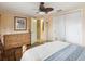 Spacious bedroom with a wooden dresser, closet, and a relaxing ambiance at 6329 Alaska Ave, New Port Richey, FL 34653