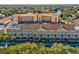 View of an attractive multi-story building with a tile roof and colorful exterior at 6329 Alaska Ave, New Port Richey, FL 34653