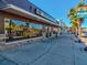Street-level view of 'The Kangaroo' business front with large windows and stone accents on a sunny day at 6329 Alaska Ave, New Port Richey, FL 34653