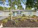 Charming one-story home with colorful landscaping, pastel exterior and matching trim at 6329 Alaska Ave, New Port Richey, FL 34653