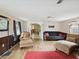 Living room with brick fireplace and ample seating at 6329 Alaska Ave, New Port Richey, FL 34653
