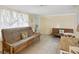 Bright living room featuring tiled floors, comfortable seating, and lots of natural light at 6329 Alaska Ave, New Port Richey, FL 34653