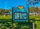Sign for New Port Richey Sims Park with details on park amenities, history, and features on a sunny day at 6329 Alaska Ave, New Port Richey, FL 34653