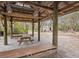 The wooden pavilion provides shade with picnic tables near a playground in the James E. Grey Preserve at 6329 Alaska Ave, New Port Richey, FL 34653