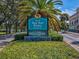 A City of New Port Richey welcome sign surrounded by lush greenery and palm trees at 6329 Alaska Ave, New Port Richey, FL 34653