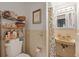 Bathroom featuring storage shelves and a sink at 6335 Kings Ct, New Port Richey, FL 34653