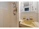 Bathroom featuring a walk-in shower and sink at 6335 Kings Ct, New Port Richey, FL 34653