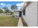 Inviting front porch with tasteful landscaping, decorative brick border, and seating, creating a warm welcome at 6335 Kings Ct, New Port Richey, FL 34653