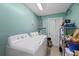 A functional laundry room with a washer and dryer at 6335 Kings Ct, New Port Richey, FL 34653