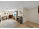 Inviting living room with tile floors, neutral colors, and natural light from large window, creates a comfortable space at 6335 Kings Ct, New Port Richey, FL 34653