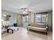 The living room has tile floors, neutral paint, and a futon couch with natural light from the windows at 6335 Kings Ct, New Port Richey, FL 34653