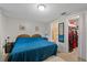 This cozy main bedroom features a bed, closet, and ensuite bathroom at 6335 Kings Ct, New Port Richey, FL 34653